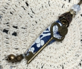 key to the white flower garden vintage tin necklace pendant